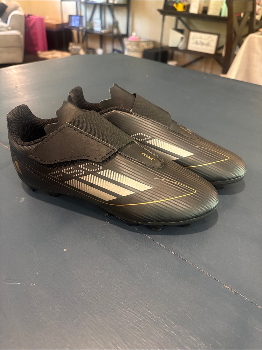 Puma Black Slip-On Soccer Spikes with Gold Accents